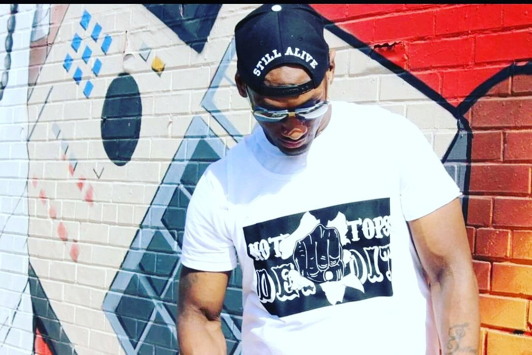 Nothing Stops Detroit Unisex White with Black Logo Fist Thru The Wall Short Sleeve Tee